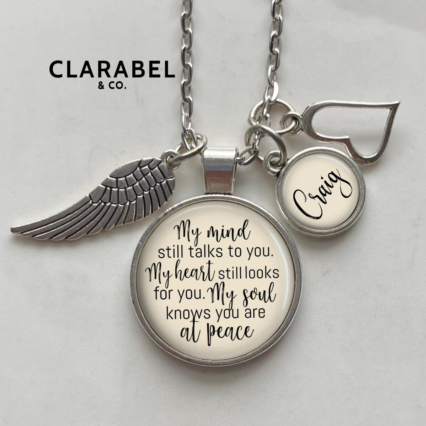 gift for grieving person. Loss of loved one gift with name charm, sympathy words, an angel wing and heart charm. “My mind still talks to you, my heart still looks for you, my soul knows you are at peace.”